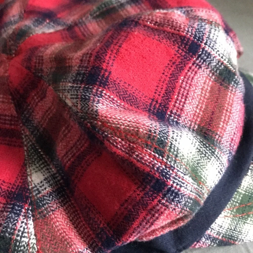 Justice plaid girls hat, Navy blue with reddish, green, silver, rosette in front